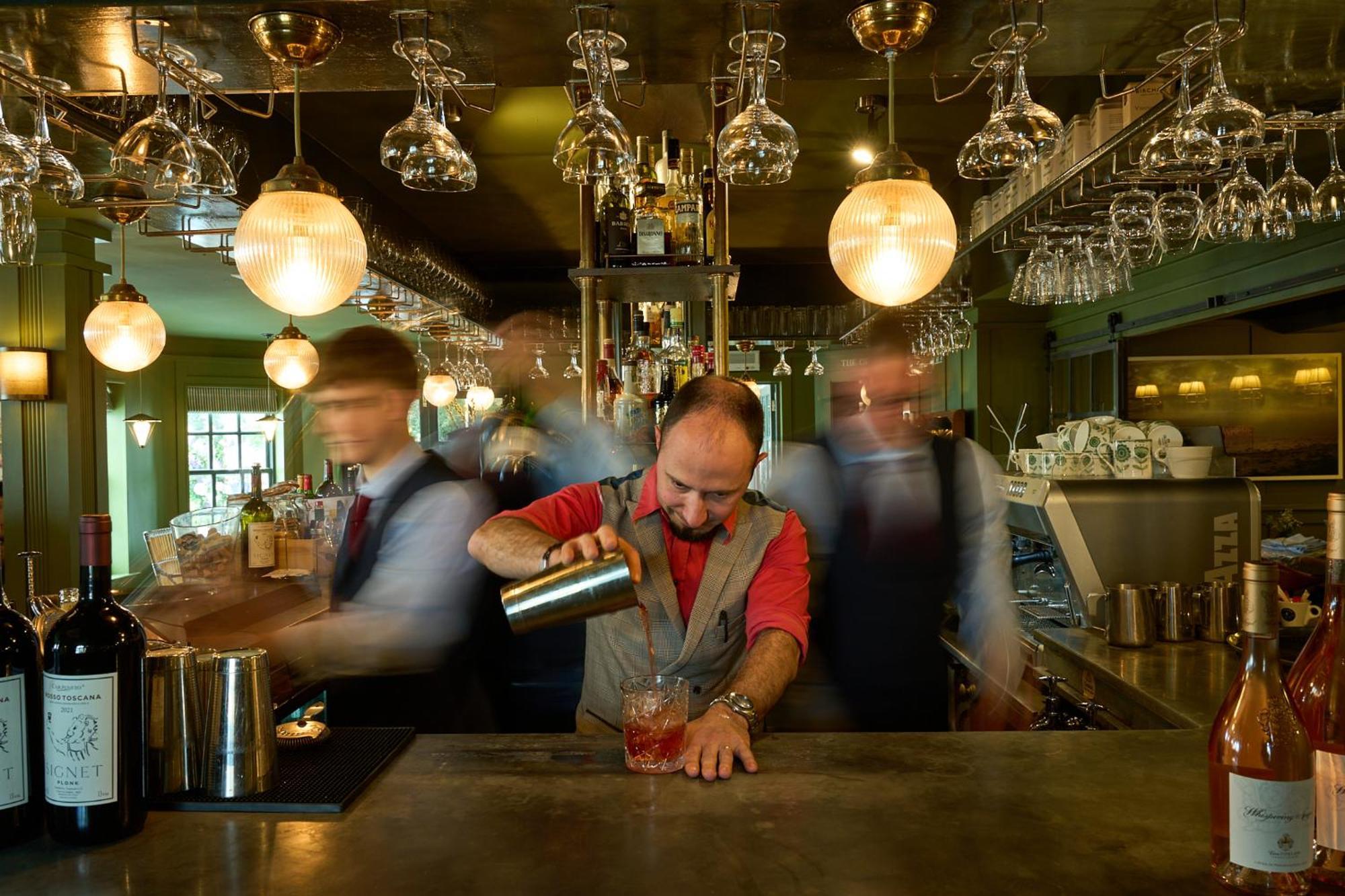 The Mitre, Hampton Court Hotel Kingston upon Thames  Exterior photo A bartender at work